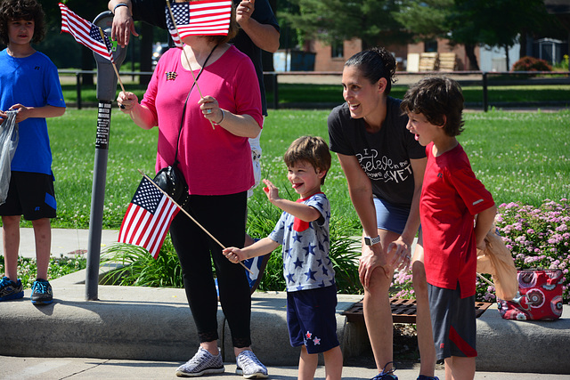 The parade route was lined by families