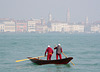 Two elderly boatmen rowing across to Dorsoduro