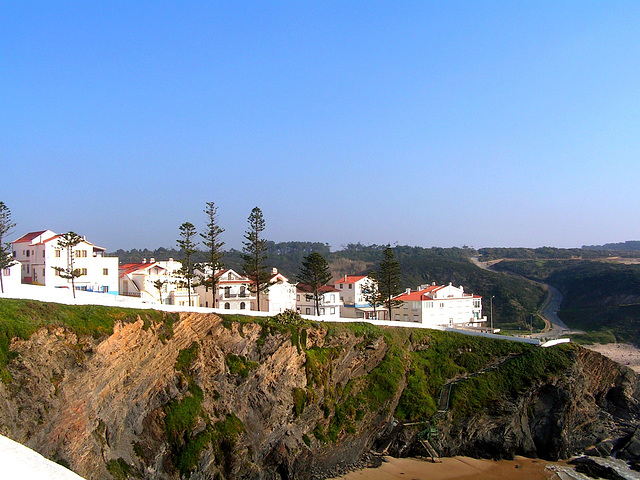 On the cliff,  the camouflaged ladder appears