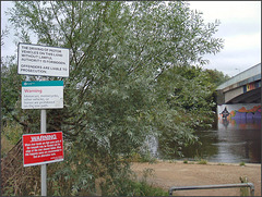 signage clutter on the river path