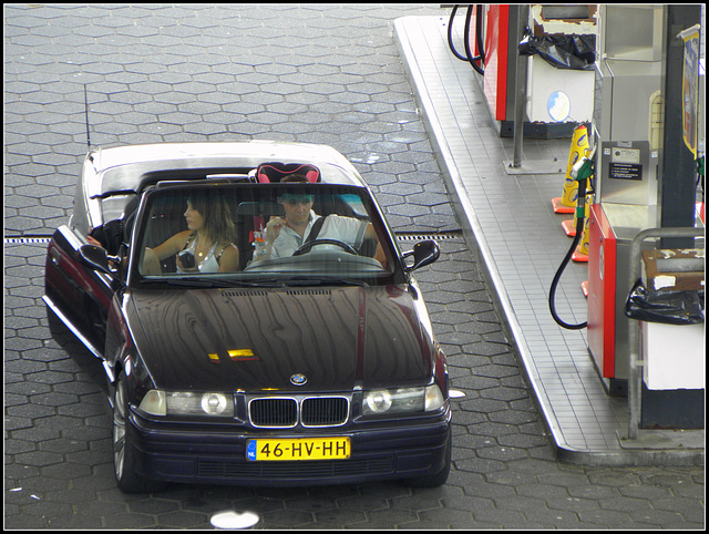 She has to go to reffuel,he keeps an eye on the car