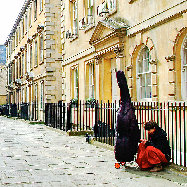 Musician Resting on North Parade Buildings