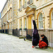 Musician Resting on North Parade Buildings