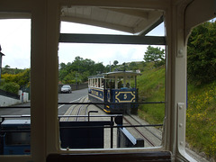 DSCF9878 Cars 5 and 4 pass on the lower section of the Great Orme Tramway