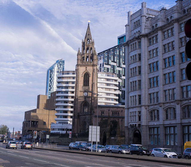 An old church alongside new buildings, Liverpool.