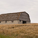 a barn on a hill