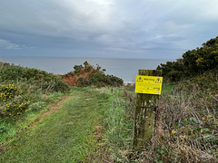 Warning! This path has been damaged by severe weather.Those using the path do so at their own risk.