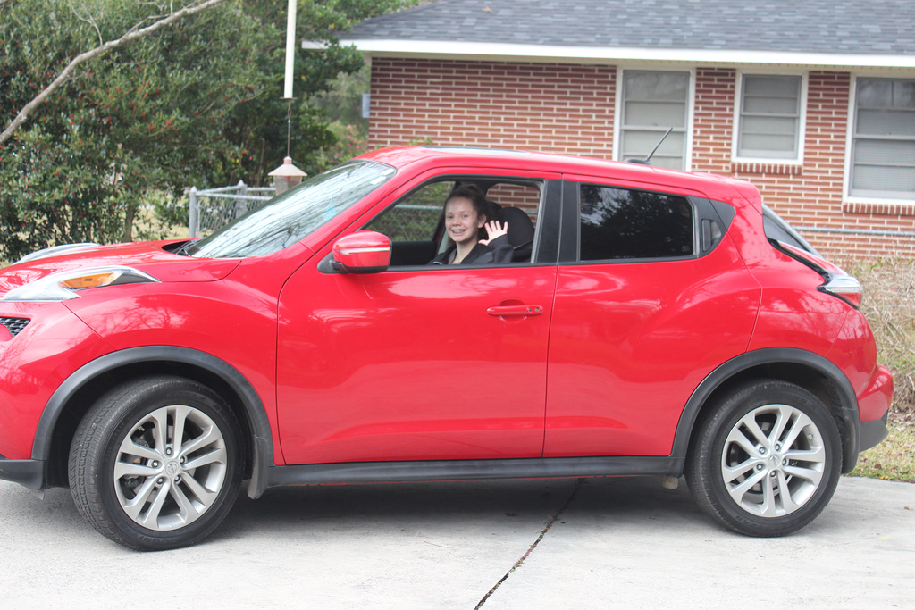 :))  She's driving her "Juke" out of our drive way last week after she received the car....