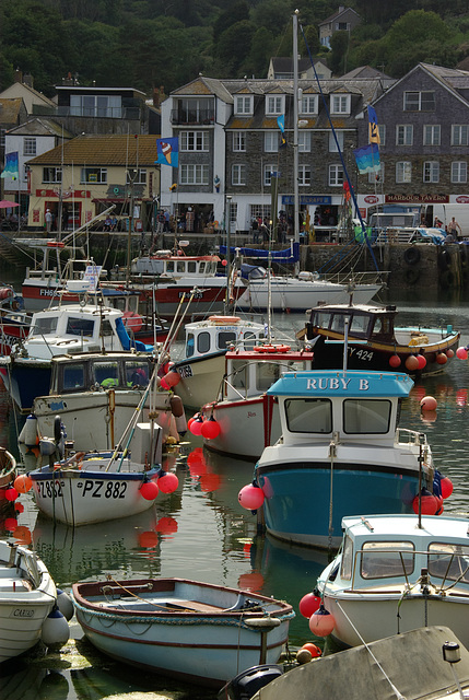 Crowded Mevagissey Harbour as the Sun goes down