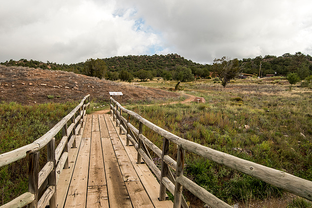 A footbridge leading to a pueblo