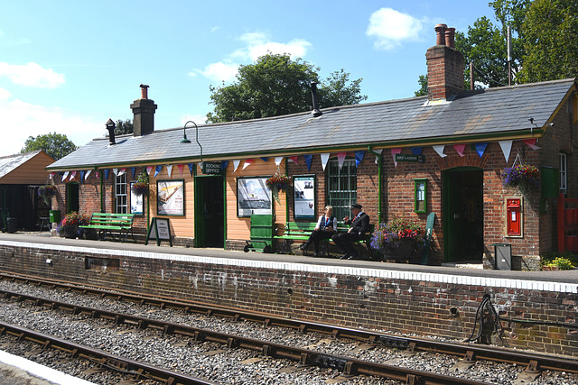 Lady and Gentleman controller sitting talking on station bench!